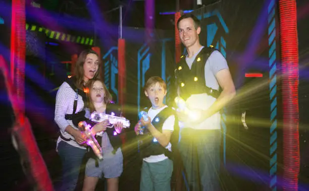 Photo of Parents and children playing laser tag in beams