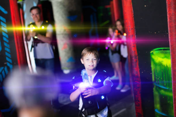 istock Boy in beams during laser tag game 1190669880