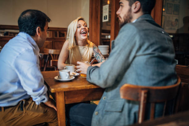istock Friends sitting in coffee shop 1190670235