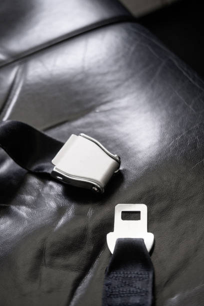 istock Airplane seatbelt on passenger black seat 1190671528