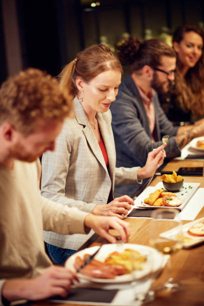 istock Friends having dinner at restaurant. 1190672831
