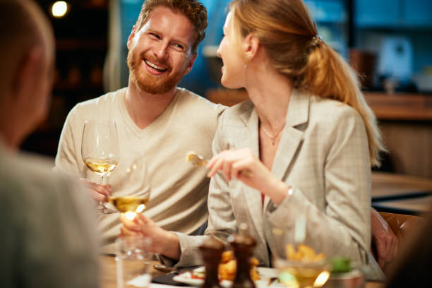 istock Friends having dinner at restaurant. 1190673062