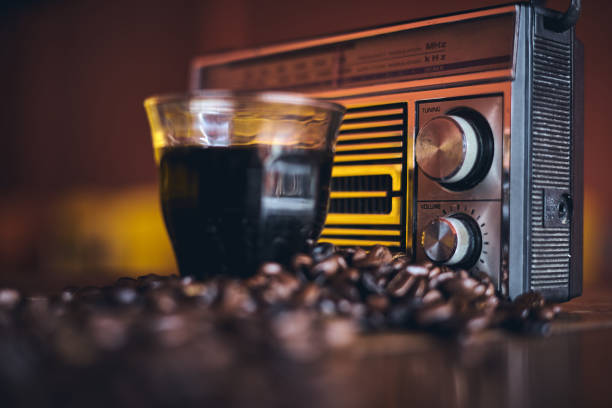 Black Coffee, Coffee beans and stylish vintage portable radio stock photo