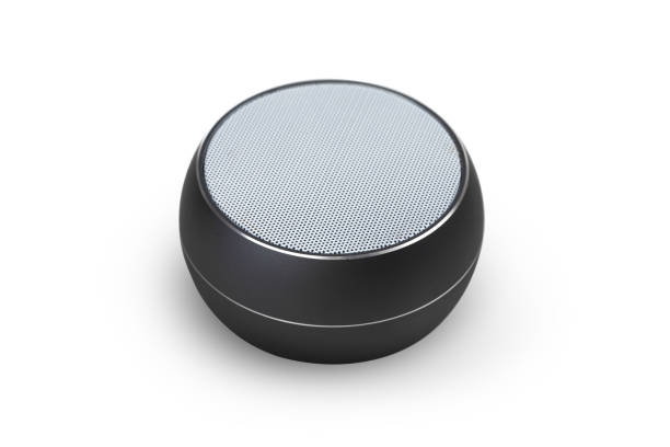 istock Wireless speaker on a white background. Round music speaker close-up. 1190674392