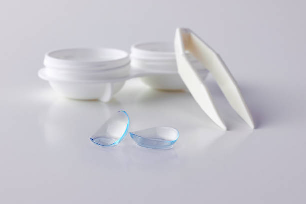 istock Contact lenses, case and tweezers on white background 1190674826