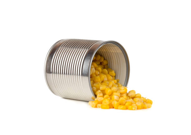 istock Canned corn on a white background. Corn closeup in an iron jar on a white background. 1190676309