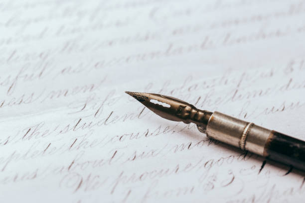 istock fountain pen on paper with ink text closeup 1190677856