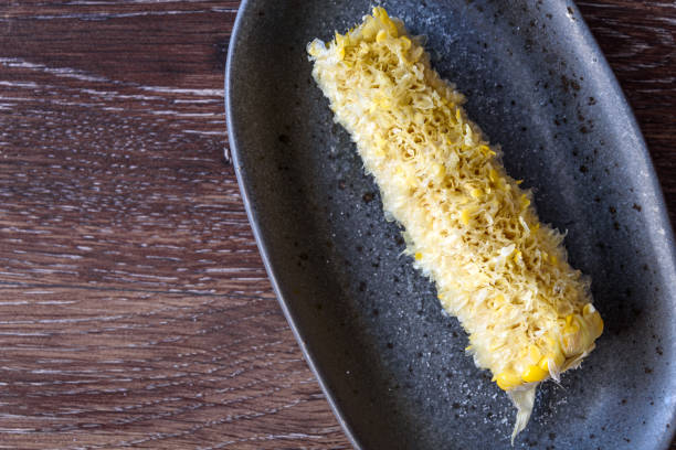 Fresh sweet corn Completely eaten corn on the cob on a gray dish corn cob eaten stock pictures, royalty-free photos & images