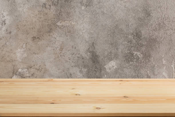 istock Wooden board empty table in front of a blurred background. Perspective brown wood with blurry grunge or old wall backdrop - can be used to showcase or mount your products. Mock up 1190677895