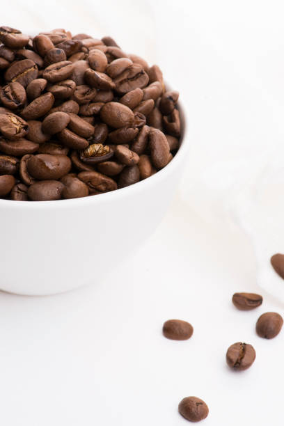 istock Bowl of caffee beans on a white background 1190679276
