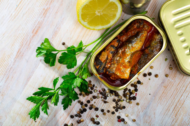 istock Tin can with smoked sprats, sardines, closeup 1190679703