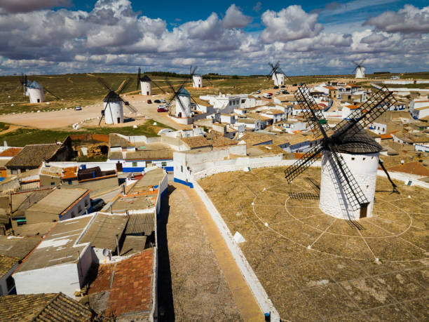 Landscape of Campo de Criptana with windmills Picturesque rural landscape of Campo de Criptana with traditional windmills in sunny day, Spain campo de criptana stock pictures, royalty-free photos & images