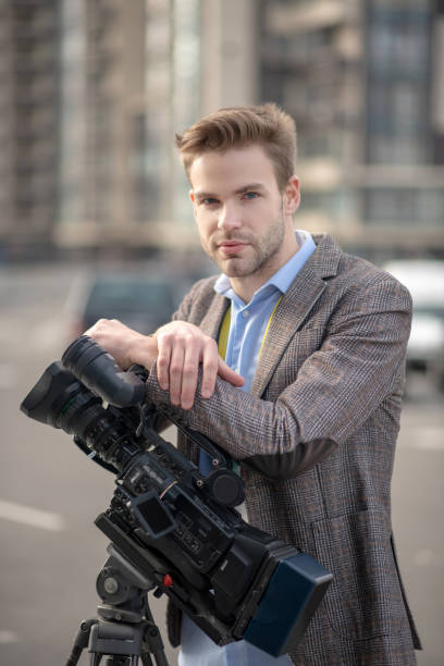 istock Young bearded operator in a blue shirt looking serious 1190684955