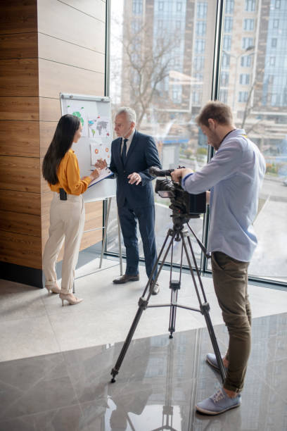 istock Journalists and their guest looking busy in the studio 1190685134