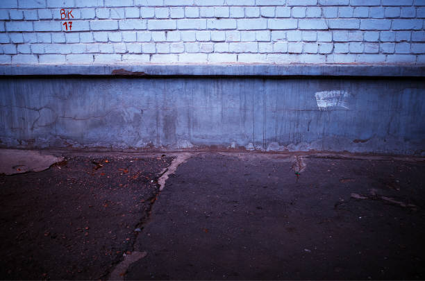 istock Cracked asphalt at city suburbs architecture background 1190685916