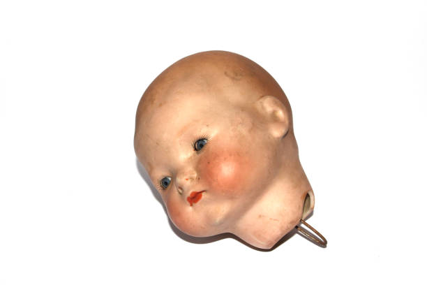 istock Weird Freaky Toy Doll Parts on White Background 1190686268