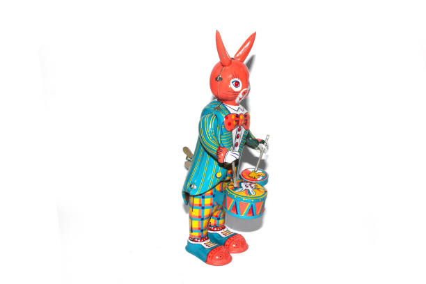 istock Tin Toy Vintage Drumming Rabbit On White Background 1190686304