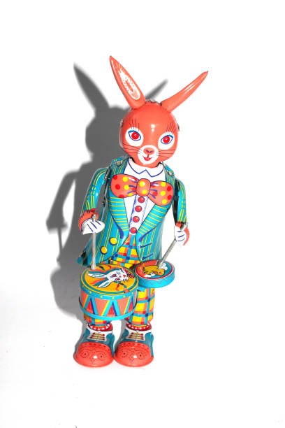 istock Tin Toy Vintage Drumming Rabbit On White Background 1190686320
