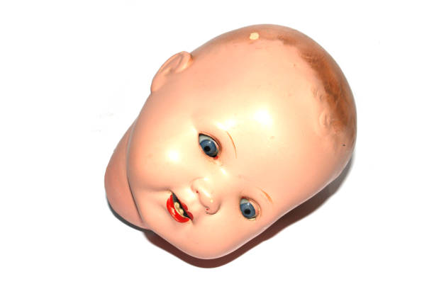 istock Weird Freaky Toy Doll Parts on White Background 1190686364
