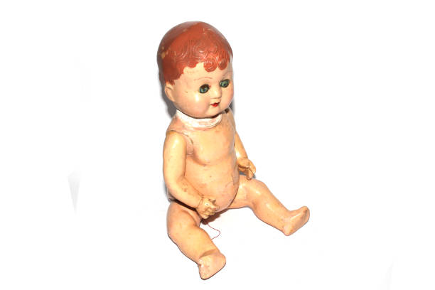 istock Weird Freaky Toy Doll Parts on White Background 1190686369