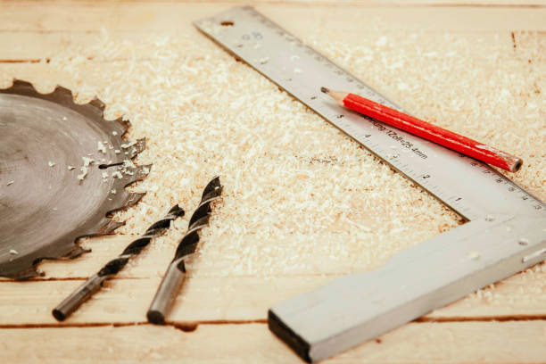 istock Saw Blade and Woodwork tools on the boards background 1190686466