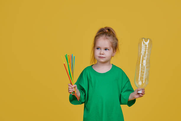 istock Little girl is separate plastic trash to recycle 1190686584