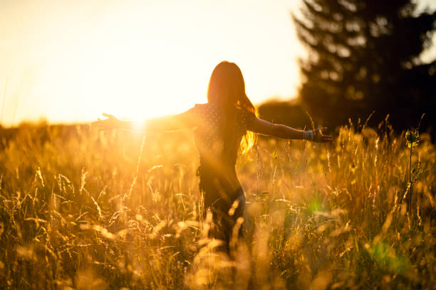 istock beautiful woman in the evening sun 1190689682