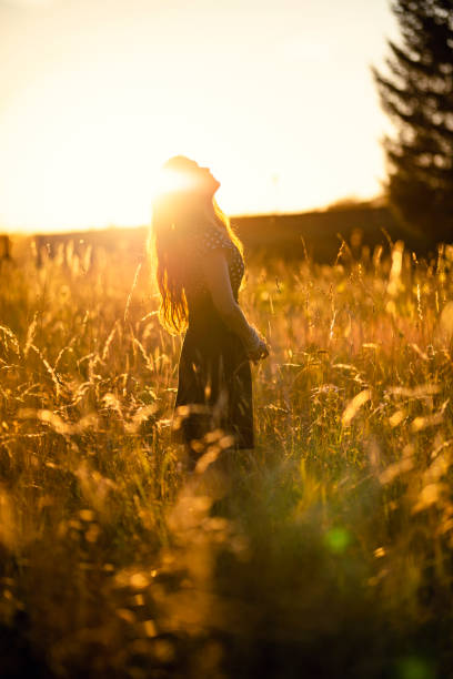istock beautiful woman in the evening sun 1190689706