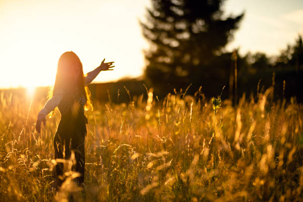 istock beautiful woman in the evening sun 1190689787