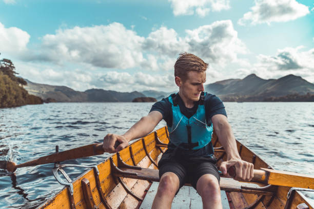 istock Man rowing boat in a lake 1190690007