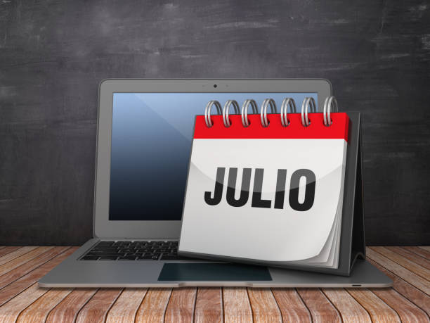 istock JULIO Calendar with Computer Laptop - Spanish Word - Chalkboard Background - 3D Rendering 1190690843