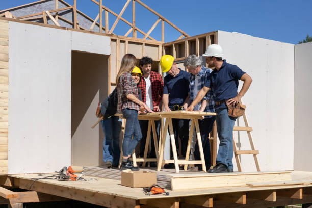 istock Group of contractors discussing a project while looking at the blueprint 1190692740