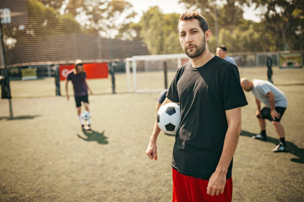 istock Soccer player before game on sport field 1190693945