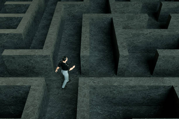 istock 3D maze labyrinth and businessman 1190694087