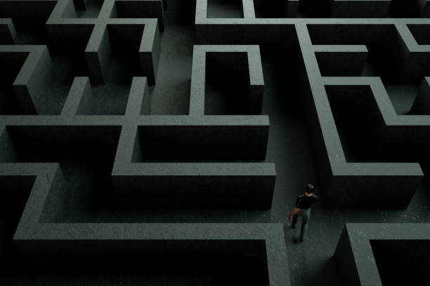 istock 3D maze labyrinth and businessman 1190694296