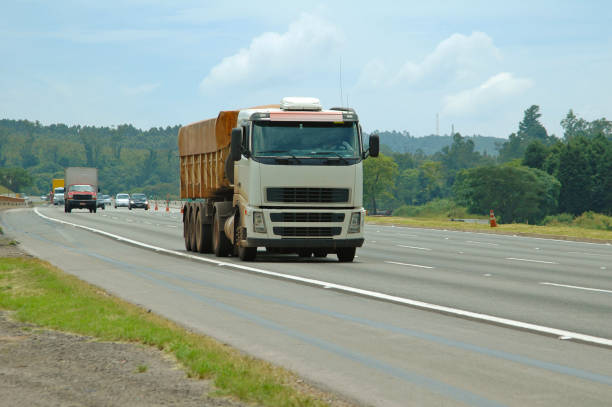 istock truck on multi-lane highway 1190699752