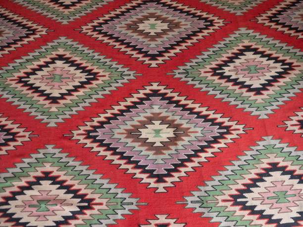 istock Close Up of a Kilim Rug with Geometric Pattern with Red Background 1190701174