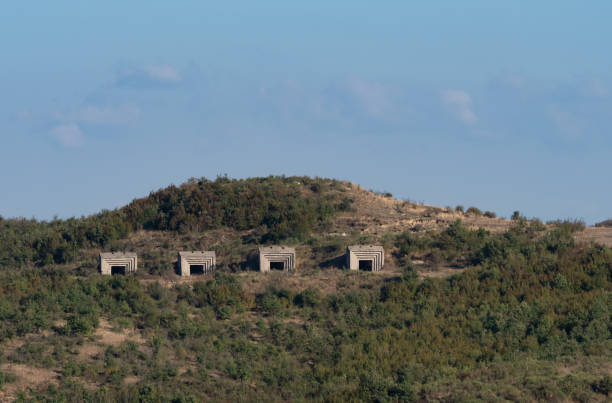 Four concrete bunkers built into a hill during Enver Hoxha's rule in the Soviet era in Albania.