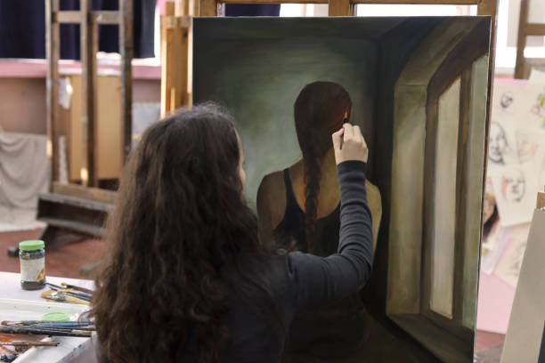 istock Girl painting in the Art studio 1190704812