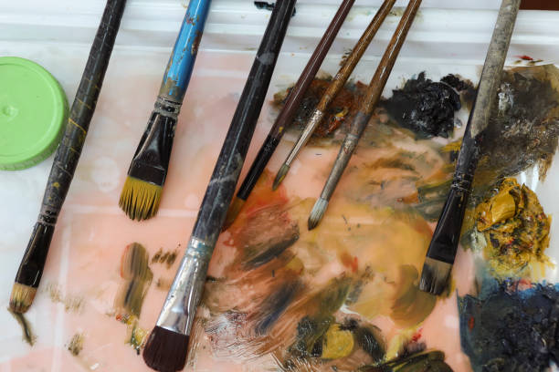 istock Paintbrushes on the table of an Art studio 1190705091