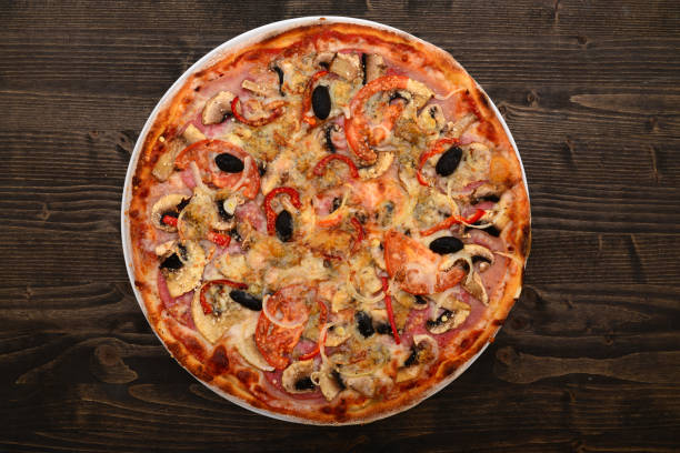 istock mushrooms and salami pizza 1190705745