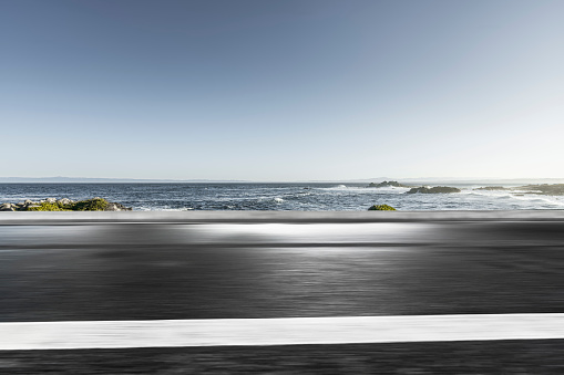 empty highway road with ocean background, Carmel, California, USA.