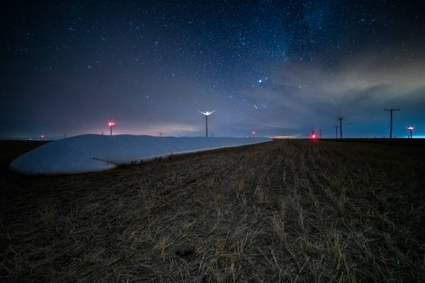istock milky way over wind turbines 1190714529