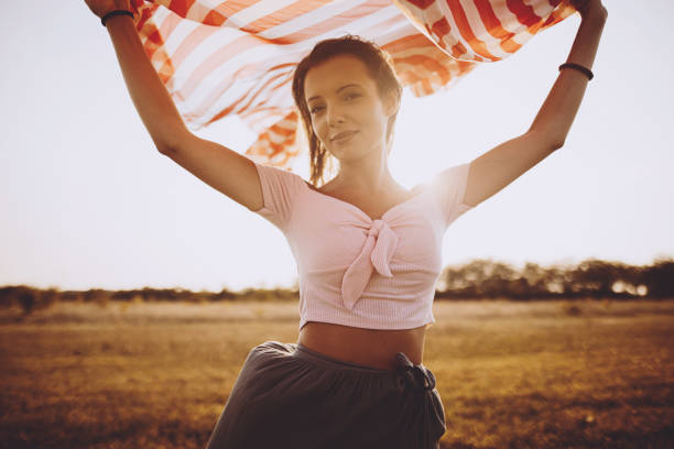 istock Beautiful girl holding a scarf 1190717534