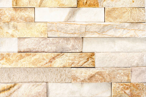 istock Close-up of Natural River Stone Cladding Mosaic Tile Wall .Old stone facade, seamless pattern . 1190717595