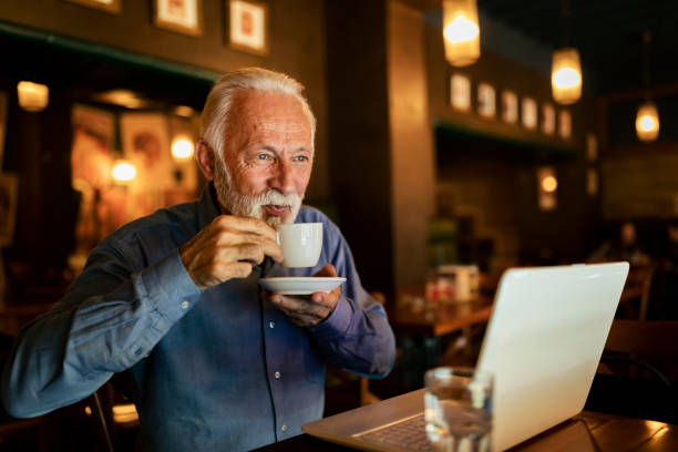 istock Senior Man Working Coffee Shop Realxation Concept 1190719386