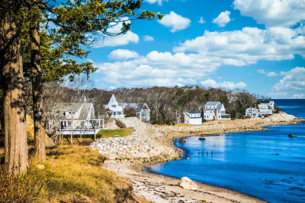 Large, comfortable homes are protected from winter storms by a substantial dike of stones in Plymouth, Massachusetts