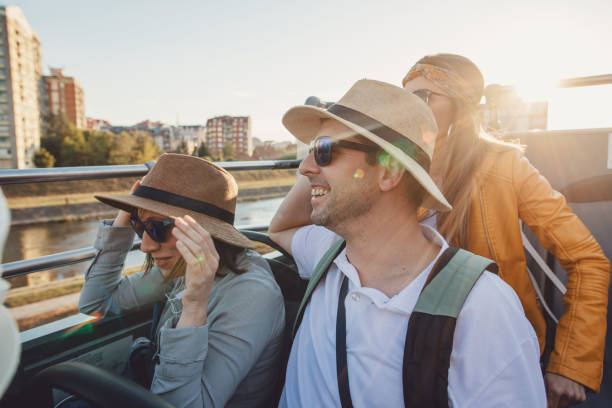 istock Holding hats because of wind blowing 1190721154