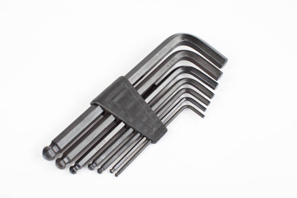 Various sizes of metal allen L hex keys on a white background