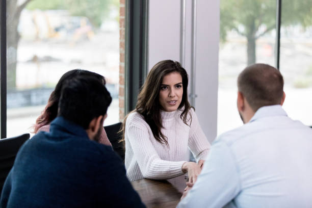 istock Diverse group meets in conference room 1190733045